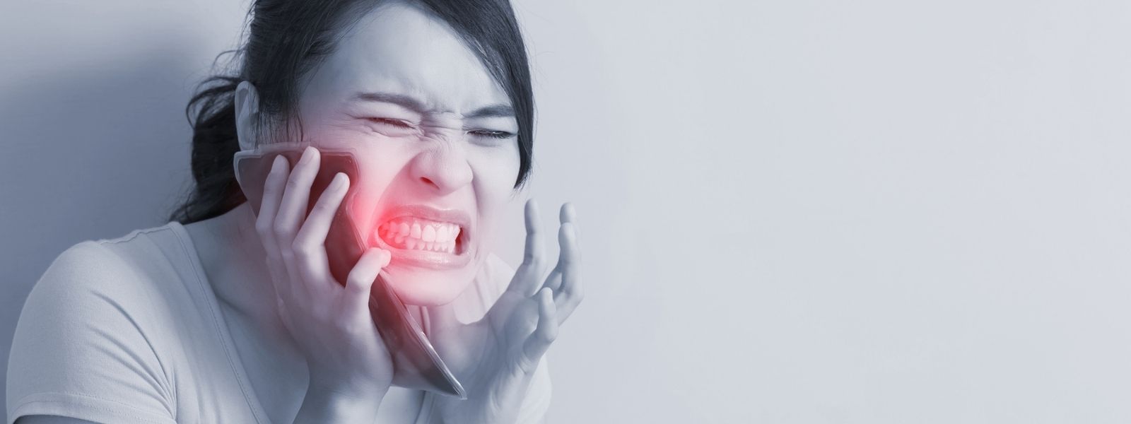 A girl in severe dental pain