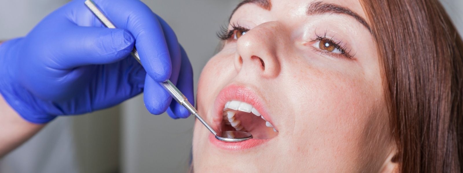 Examining a patient by a Dentist for a Root canal treatment
